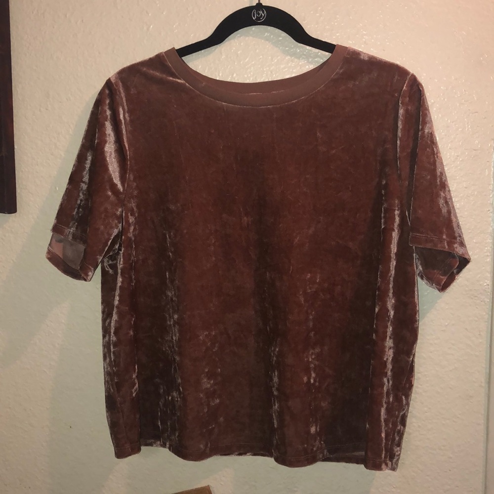 A velvet textured gold/pink short sleeved shirt